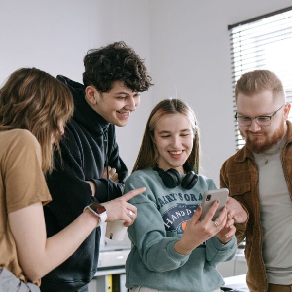 people looking at phone together