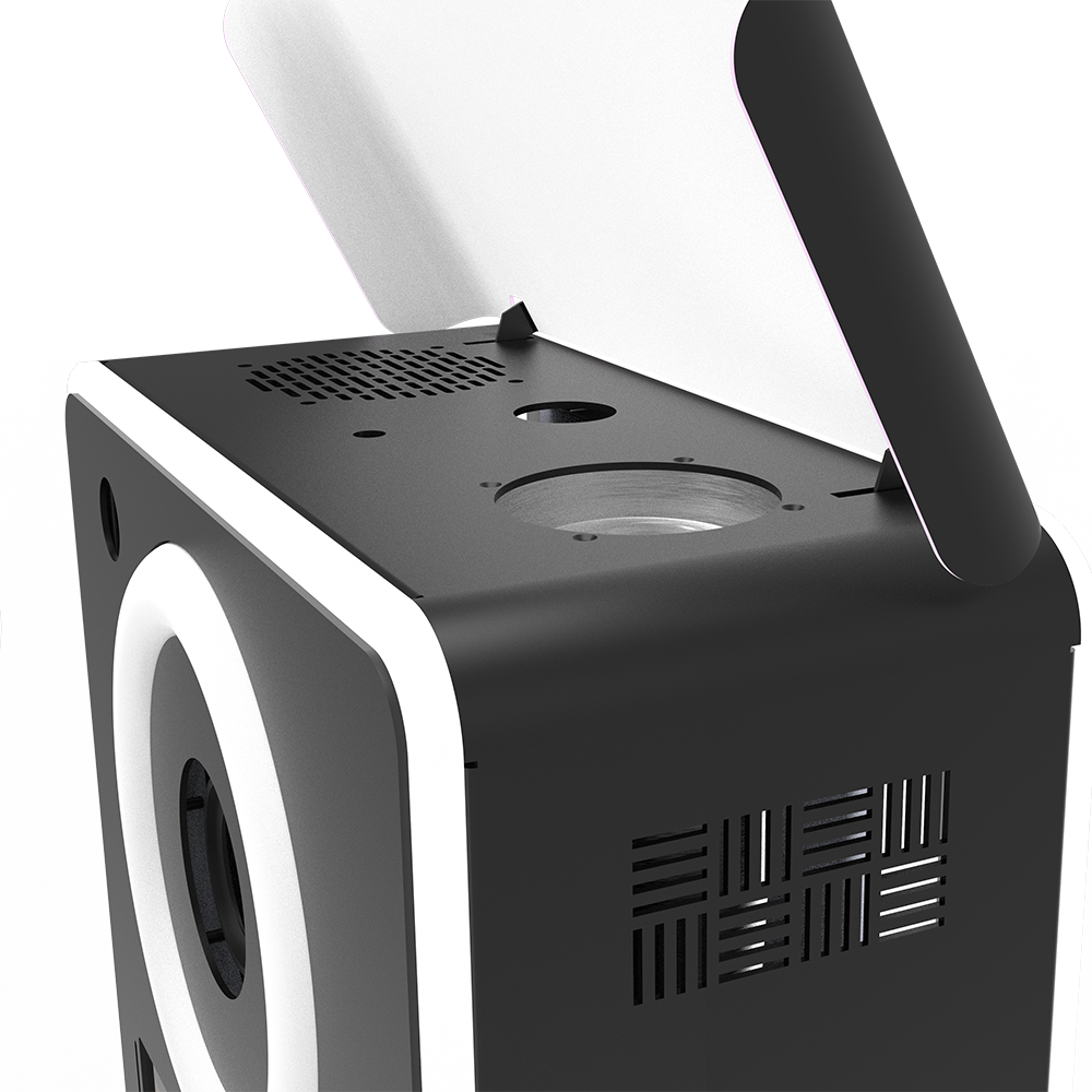A close-up, high-angle view of a black Lumia M Pro head unit, showcasing the top flash mount, ventilation grilles, and the base of the white bounce card.